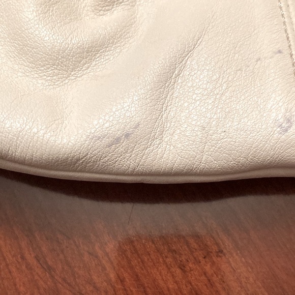 COACH PURSE. Bone colored with tan trim. Pleated. Back slip pocket. Clean inside - Picture 10 of 10